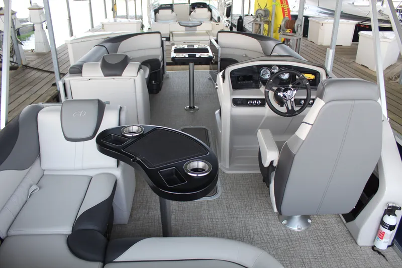 Slide: The Image of The image shows the interior of a 2024 Avalon LSZ RF 2585 with luxurious seating and a modern helm. - 13