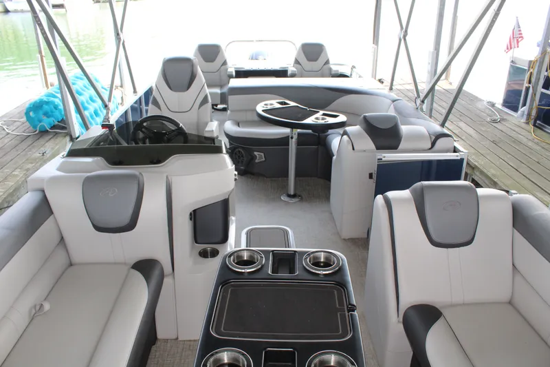 Slide: The Image of The image shows the interior of a 2024 Avalon LSZ RF 2585. It features luxurious seating and a table. - 18