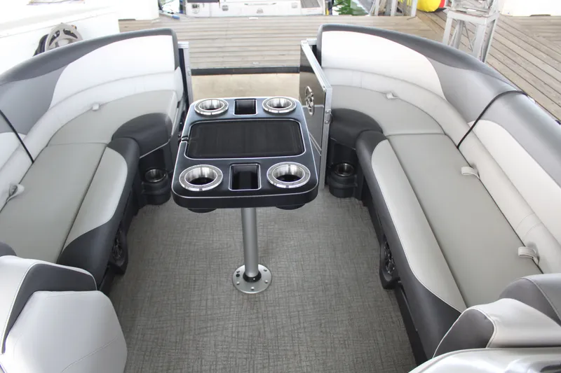 Slide: The Image of The image shows the interior of a 2024 Avalon LSZ RF 2585 with gray and white seating. - 17