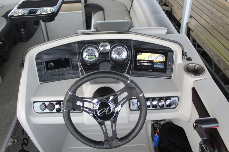 Slide: The Image of The image shows the helm of a 2024 Avalon LSZ RF 2585 with modern instruments. - 9