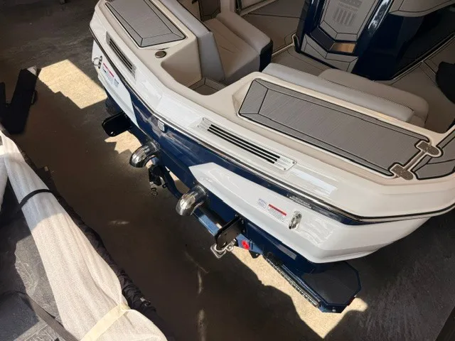 Slide: The Image of The image shows the rear of a 2026 MasterCraft ProStar with polished metal components. - 4
