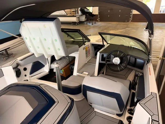 Slide: The Image of The image shows the cockpit of a 2026 MasterCraft ProStar with modern seating and a sleek steering wheel. - 7