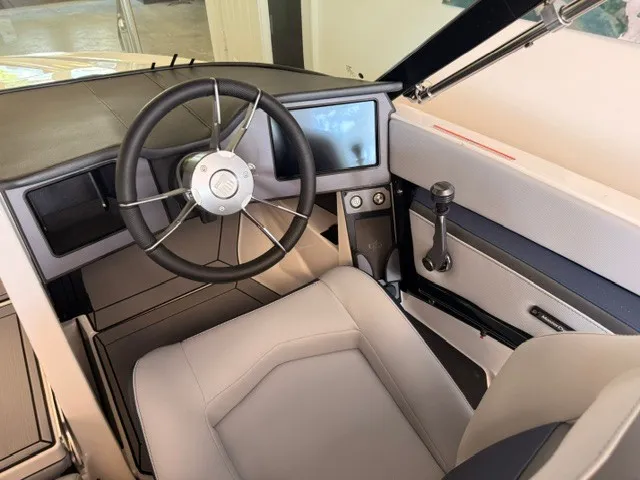 Slide: The Image of The image shows the cockpit of a 2026 MasterCraft ProStar with a modern steering wheel and display. - 6