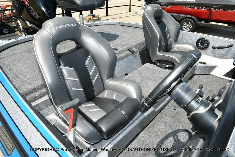 Slide: The Image of The image shows the interior of a 2021 Nitro Z21 Pro with two padded seats. - 16