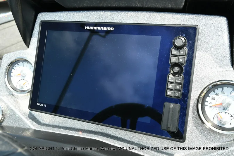 Slide: The Image of A modern navigation system with a large screen and multiple controls on a boat. - 39