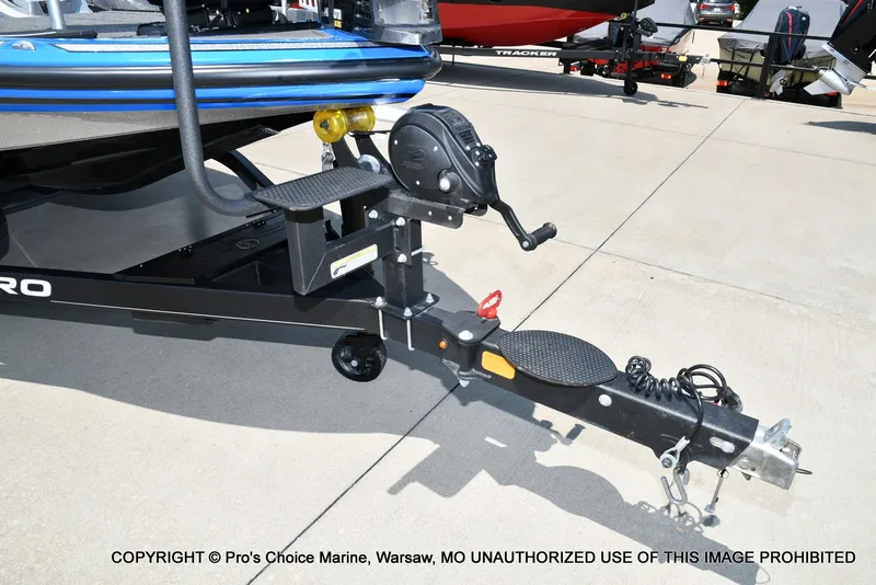 Slide: The Image of The trailer of a 2021 Nitro Z21 Pro with a winch and safety chains. - 32