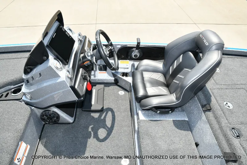 Slide: The Image of The image shows the cockpit of a 2021 Nitro Z21 Pro boat with a modern helm. - 47