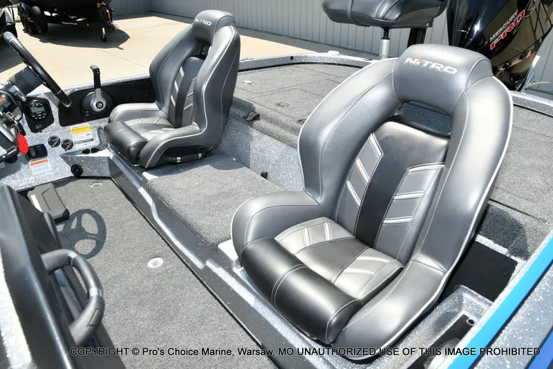 Slide: The Image of The image shows the interior of a 2021 Nitro Z21 Pro boat with two padded seats. - 18