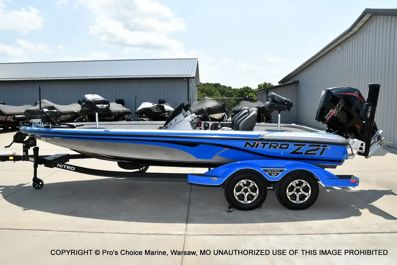 Slide: The Image of A blue 2021 Nitro Z21 Pro on a trailer in front of a building. - 27