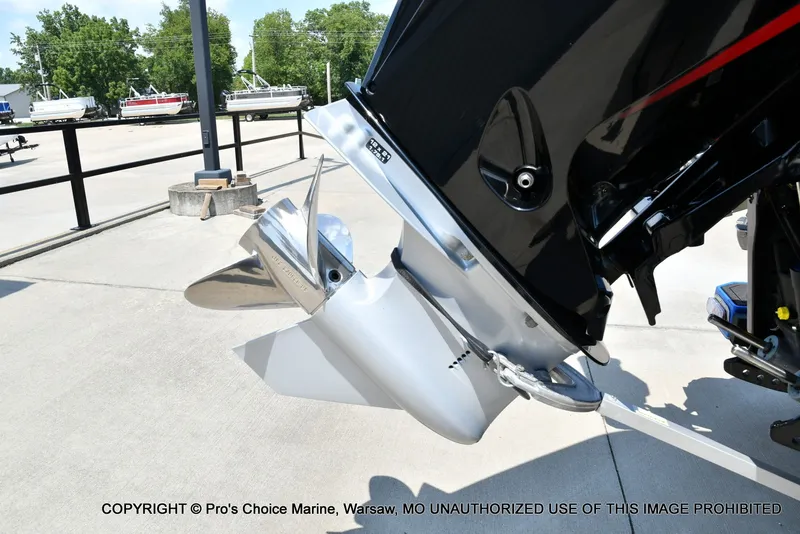 Slide: The Image of Close-up of a boat propeller on a trailer, surrounded by other boats in the background. - 23