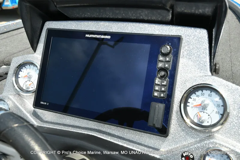 Slide: The Image of The image shows a modern boat dashboard with a large Humminbird screen and two analog gauges. - 8