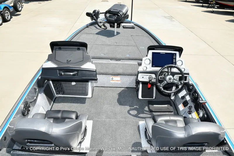 Slide: The Image of The image shows the cockpit of a 2021 Nitro Z21 Pro boat with gray seats and modern electronics. - 44