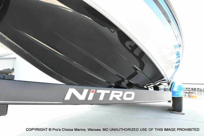 Slide: The Image of Close-up of the hull of a Nitro Z21 Pro boat on a trailer. - 34
