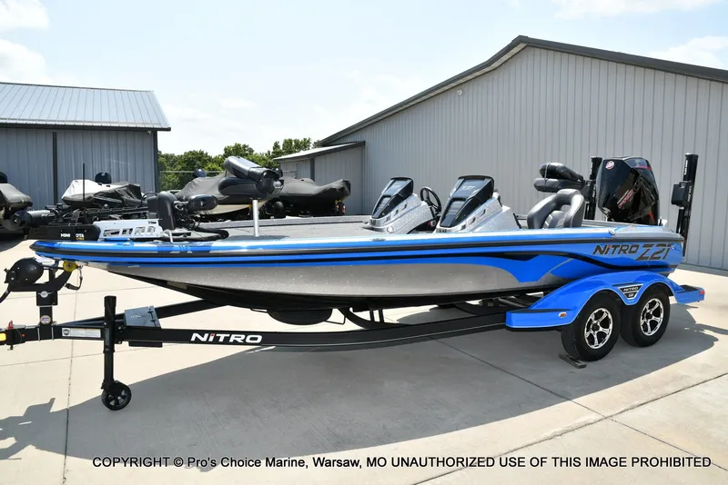 Slide: The Image of A blue 2021 Nitro Z21 Pro on a trailer in front of a building. - 21