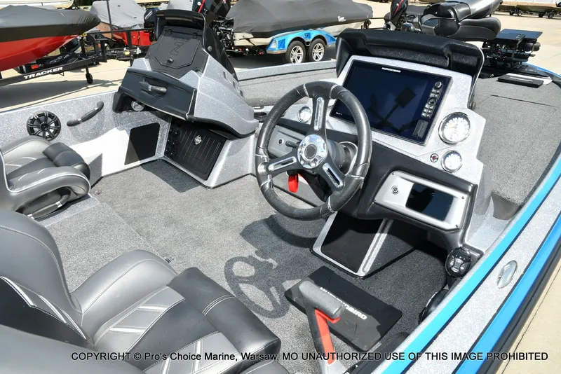 Slide: The Image of The image shows the cockpit of a 2021 Nitro Z21 Pro boat with modern instruments. - 7