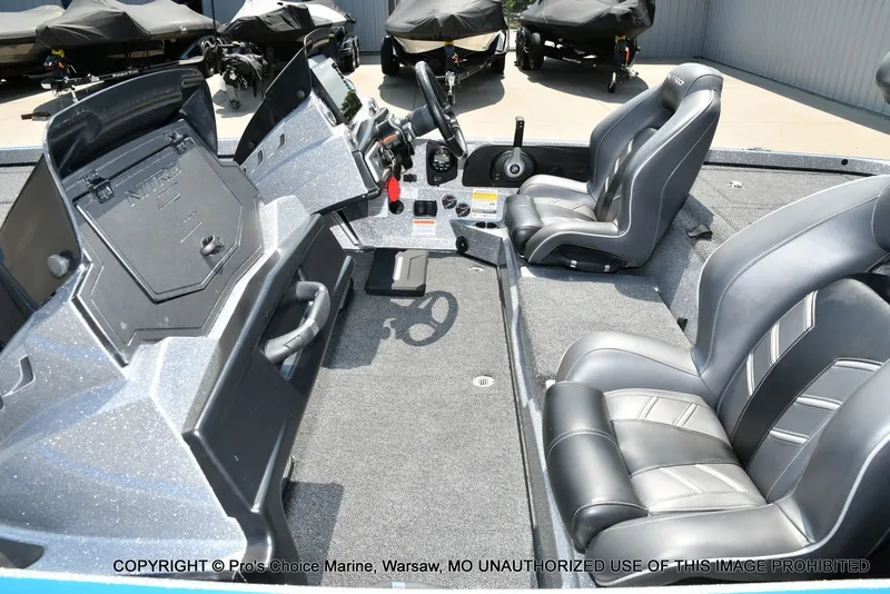Slide: The Image of The image shows the cockpit of a 2021 Nitro Z21 Pro boat with two padded seats. - 42