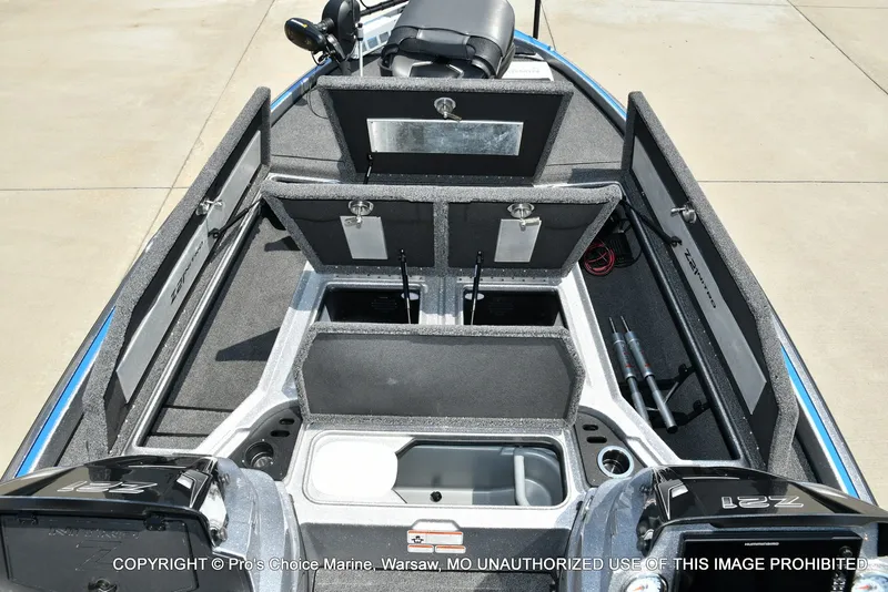 Slide: The Image of The image shows the deck of a 2021 Nitro Z21 Pro boat with multiple storage compartments. - 12