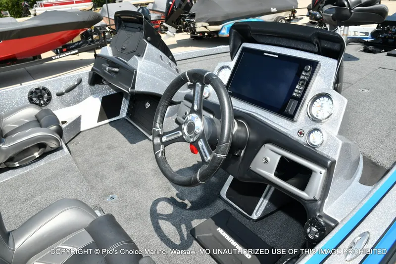 Slide: The Image of The image shows the cockpit of a 2021 Nitro Z21 Pro boat with a modern helm. - 38
