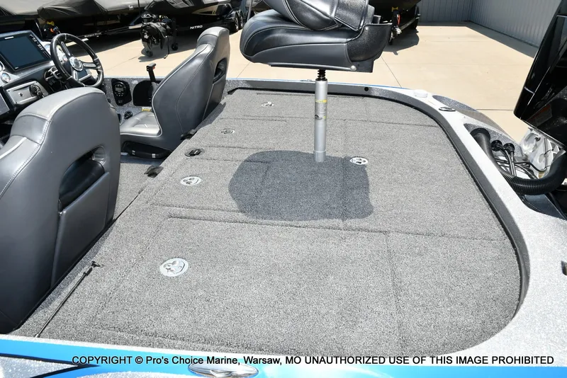 Slide: The Image of The image shows the cockpit of a 2021 Nitro Z21 Pro boat with gray carpet flooring. - 40
