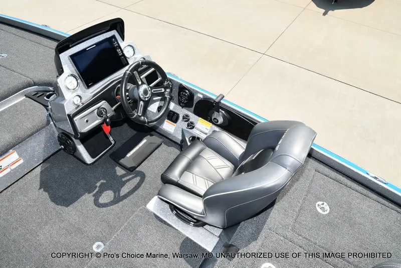 Slide: The Image of The image shows the cockpit of a 2021 Nitro Z21 Pro boat with a modern helm and cushioned seat. - 45