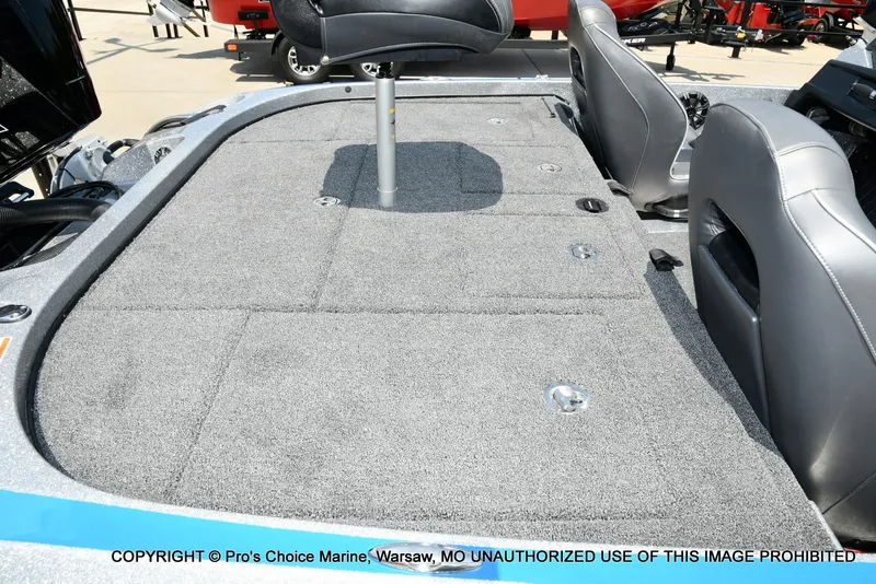 Slide: The Image of The image shows the deck of a 2021 Nitro Z21 Pro boat with gray carpeting. - 37