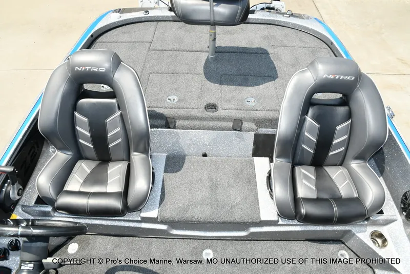 Slide: The Image of The image shows the interior of a 2021 Nitro Z21 Pro boat with two padded seats. - 20
