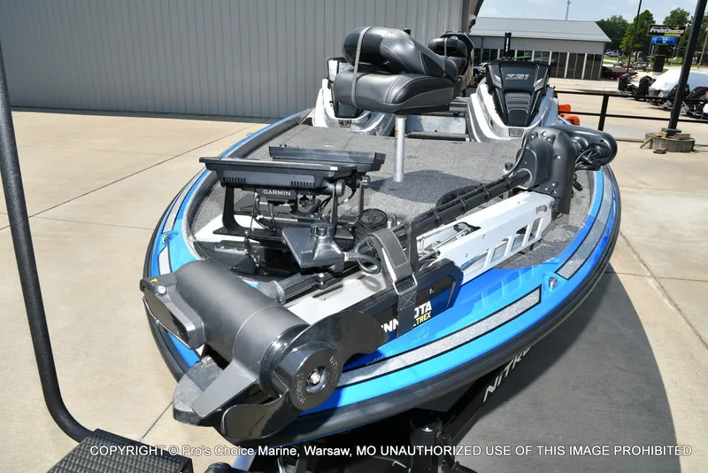 Slide: The Image of A blue and white 2021 Nitro Z21 Pro with modern fishing equipment on the deck. - 30