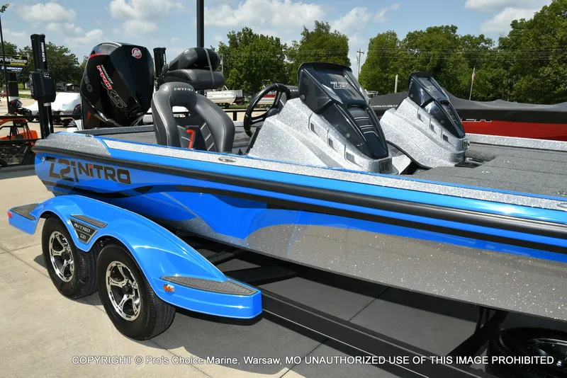 Slide: The Image of A blue 2021 Nitro Z21 Pro on a trailer. It features two seats and a sleek design. - 3