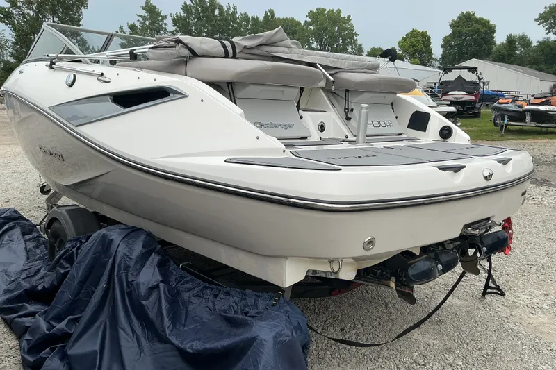 Slide: The Image of A white 2010 Sea-Doo Sport Boat, model 210 Challenger SE, is on a trailer. - 20