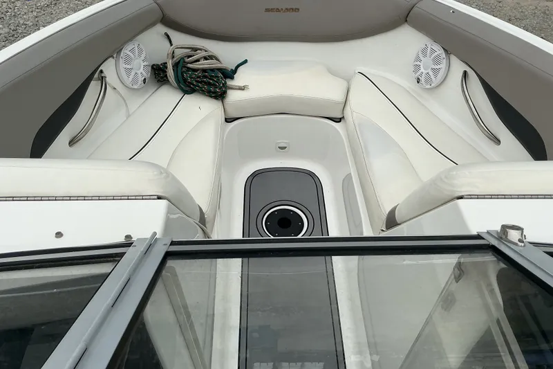 Slide: The Image of The image shows the bow area of a Sea-Doo sport boat with white upholstery and speakers. - 7