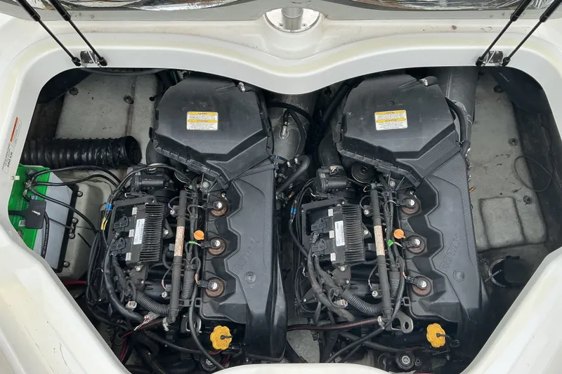 Slide: The Image of The engine compartment of a 2010 Sea-Doo 210 Challenger SE with dual engines and wiring. - 13