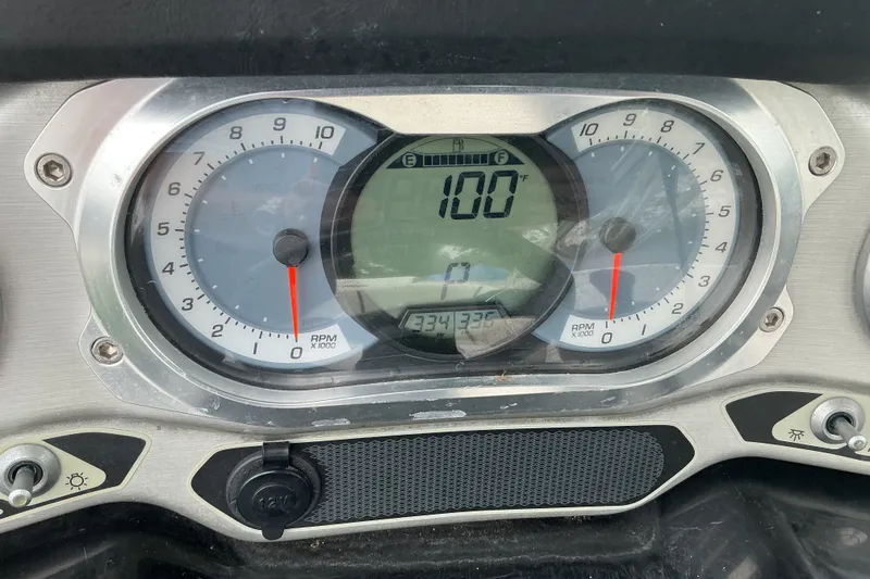 Slide: The Image of Close-up of a 2010 Sea-Doo 210 Challenger SE dashboard with speedometer and tachometer. - 11