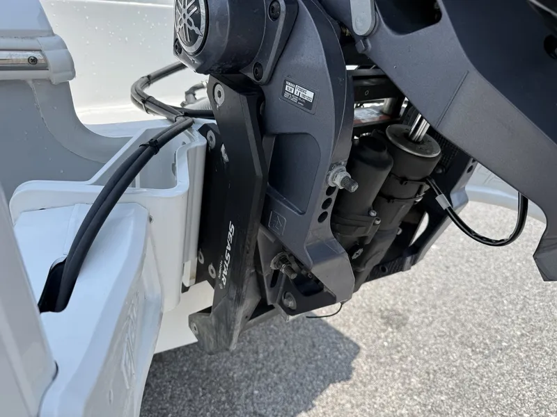 Slide: The Image of Close-up of an outboard motor with Yamaha logo, mounted on a white boat. - 4