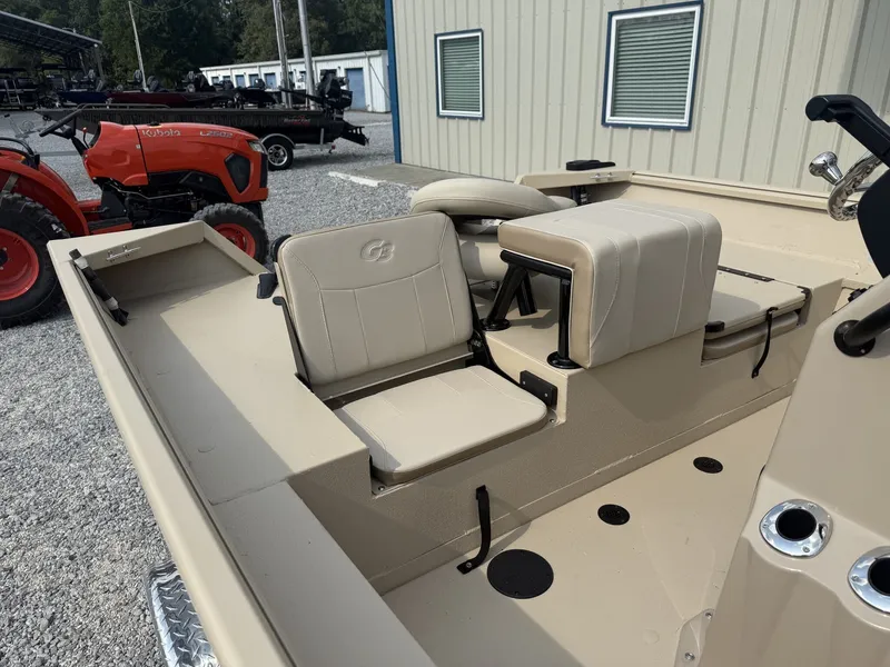 Slide: The Image of The image shows the interior of a 2027 G3 Bay 20 boat with beige seating. - 4