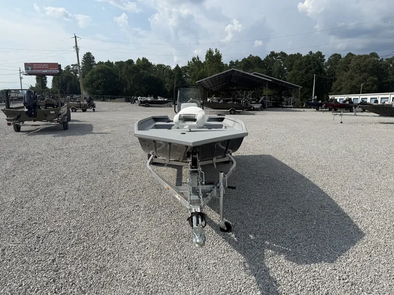 Slide: The Image of A 2027 G3 Bay 18 BAY-F90 SHO boat on a trailer in a gravel lot. - 4