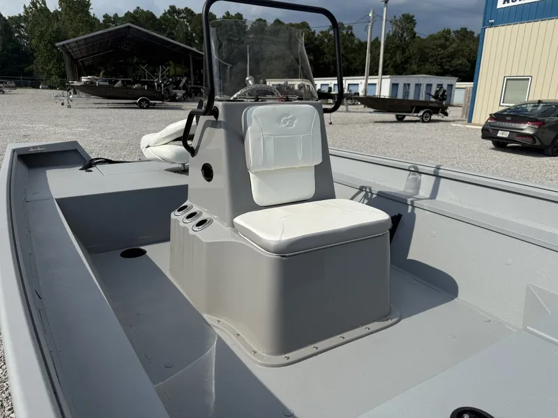 Slide: The Image of The image shows a gray G3 Bay 18 BAY-F90 SHO boat with a central console and white seating. - 6