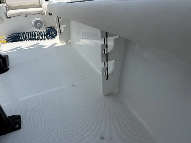 Slide: The Image of The image shows the interior of a 2024 Sea Hunt BX Series 22-LOADED OUT boat. It features a clean, white surface with an integrated mounting system. - 6
