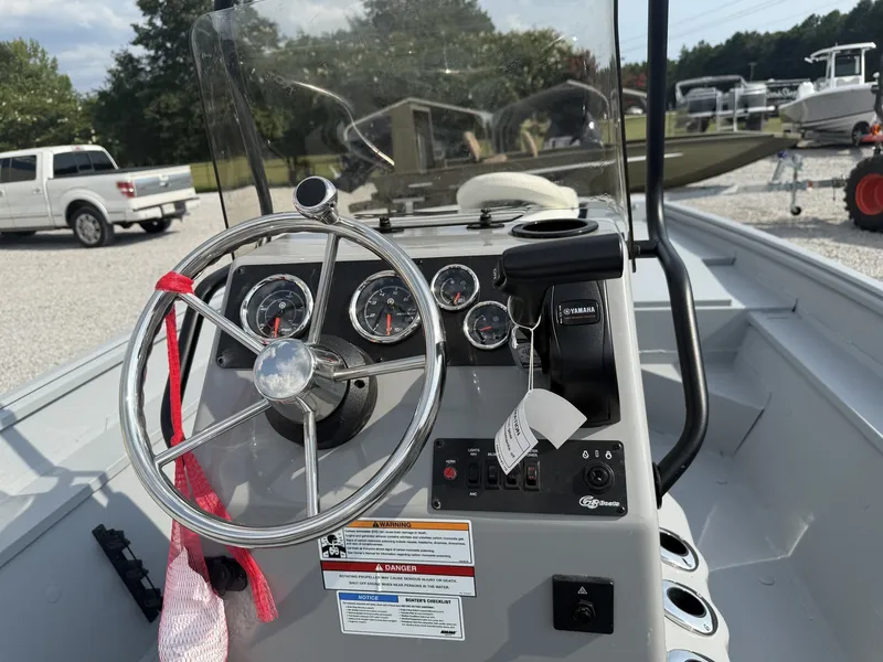 Slide: The Image of The image shows the helm of a G3 Bay 18 BAY-F90 SHO boat with various instruments. - 5