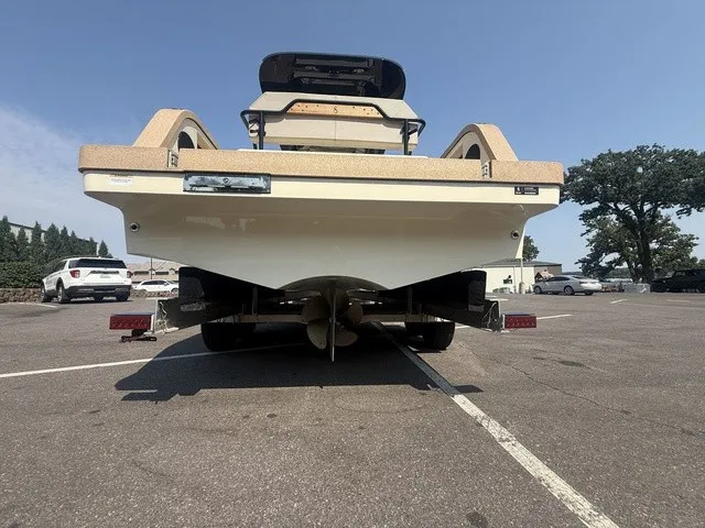 Slide: The Image of The image shows the rear of a 2023 X Shore Eelex 8000 boat in a parking lot. - 3