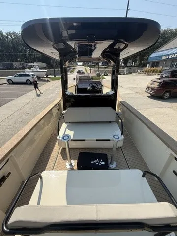 Slide: The Image of The image shows the deck of a 2023 X Shore Eelex 8000 boat with benches and a table. - 14