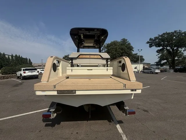 Slide: The Image of The image shows a rear view of an X Shore Eelex 8000 boat in a parking lot. - 11
