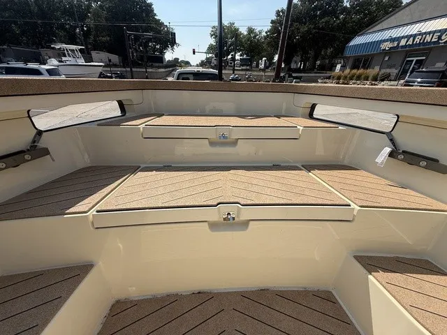 Slide: The Image of The image shows the cockpit of a 2023 X Shore Eelex 8000 with wooden flooring and benches. - 18
