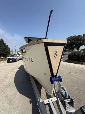 Slide: The Image of A modern boat named X Shore Eelex 8000 on a trailer, ready for transport. - 5
