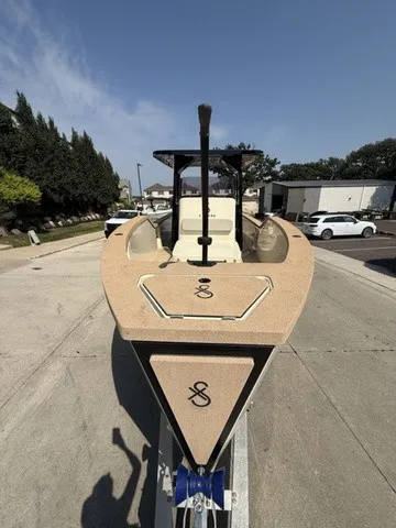 Slide: The Image of A modern electric boat with sleek design sits on a trailer in an urban setting. - 8