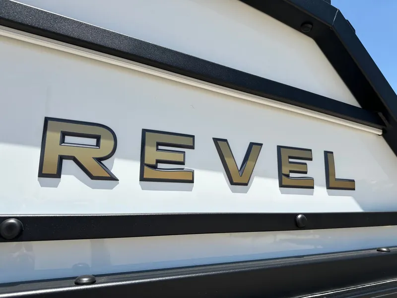 Slide: The Image of Close-up of the "Revel" lettering on a boat, featuring clean lines and modern design. - 10