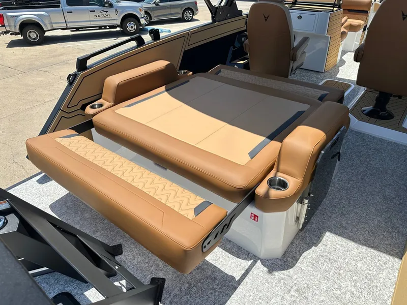 Slide: The Image of The image shows the interior of a 2027 Revel RL23 with brown leather seats and a fold-out seating area. - 36