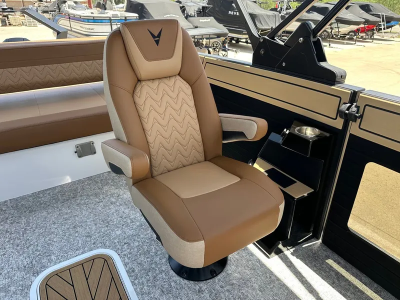 Slide: The Image of A luxurious captain's chair in a modern boat with brown and beige upholstery and armrests. - 22