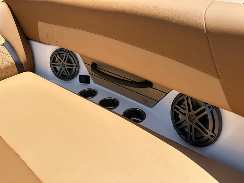 Slide: The Image of The interior of the 2027 Revel RL23 features beige upholstery and speakers. - 16