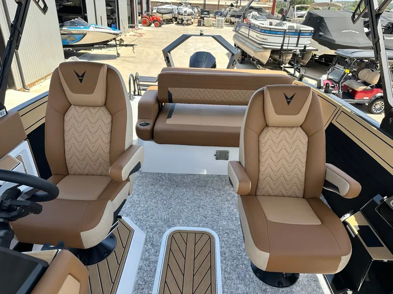 Slide: The Image of The image shows the cockpit of a 2027 Revel RL23 with two swivel seats and a rear bench. - 21