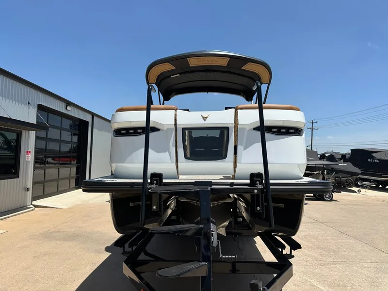 Slide: The Image of The image shows a modern boat on a trailer in a storage area. - 9